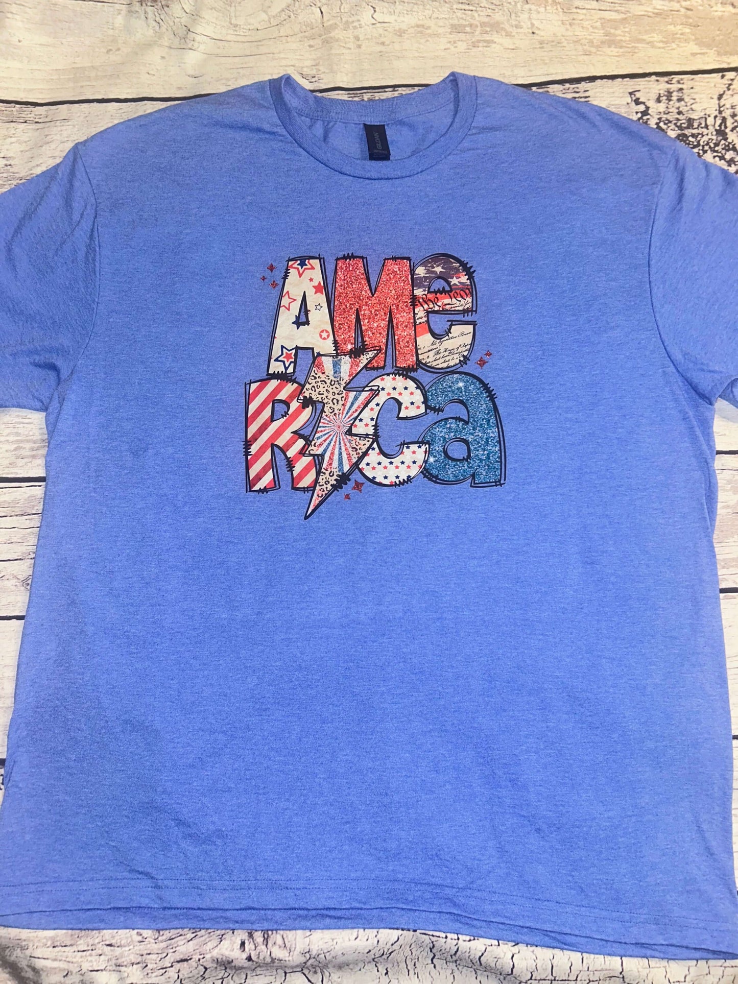 America Tee for the 4th of July with patch work design on heather royal blue shirt