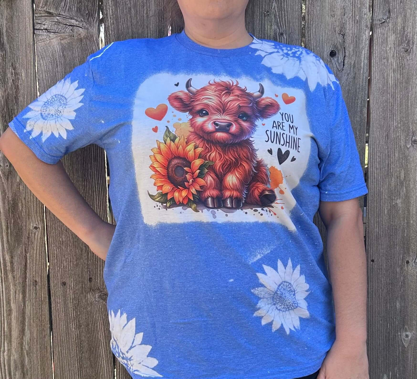 Bleached shirt with highland cow and you are my sunshine on a heather royal tee