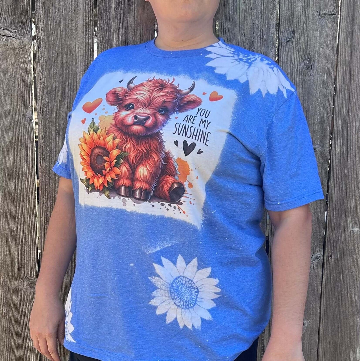 Bleached shirt with highland cow and you are my sunshine on a heather royal tee