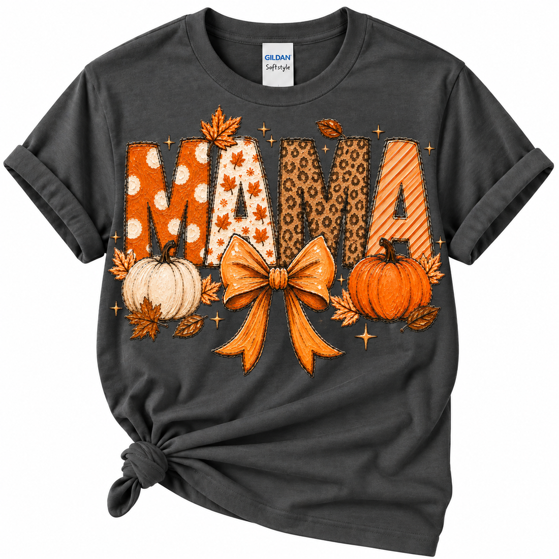A dark charcoal gray Gildan Softstyle t-shirt with a rolled hem knot, featuring a 'MAMA' autumn graphic with pumpkins, leaves, and leopard/striped patterns on a white background.