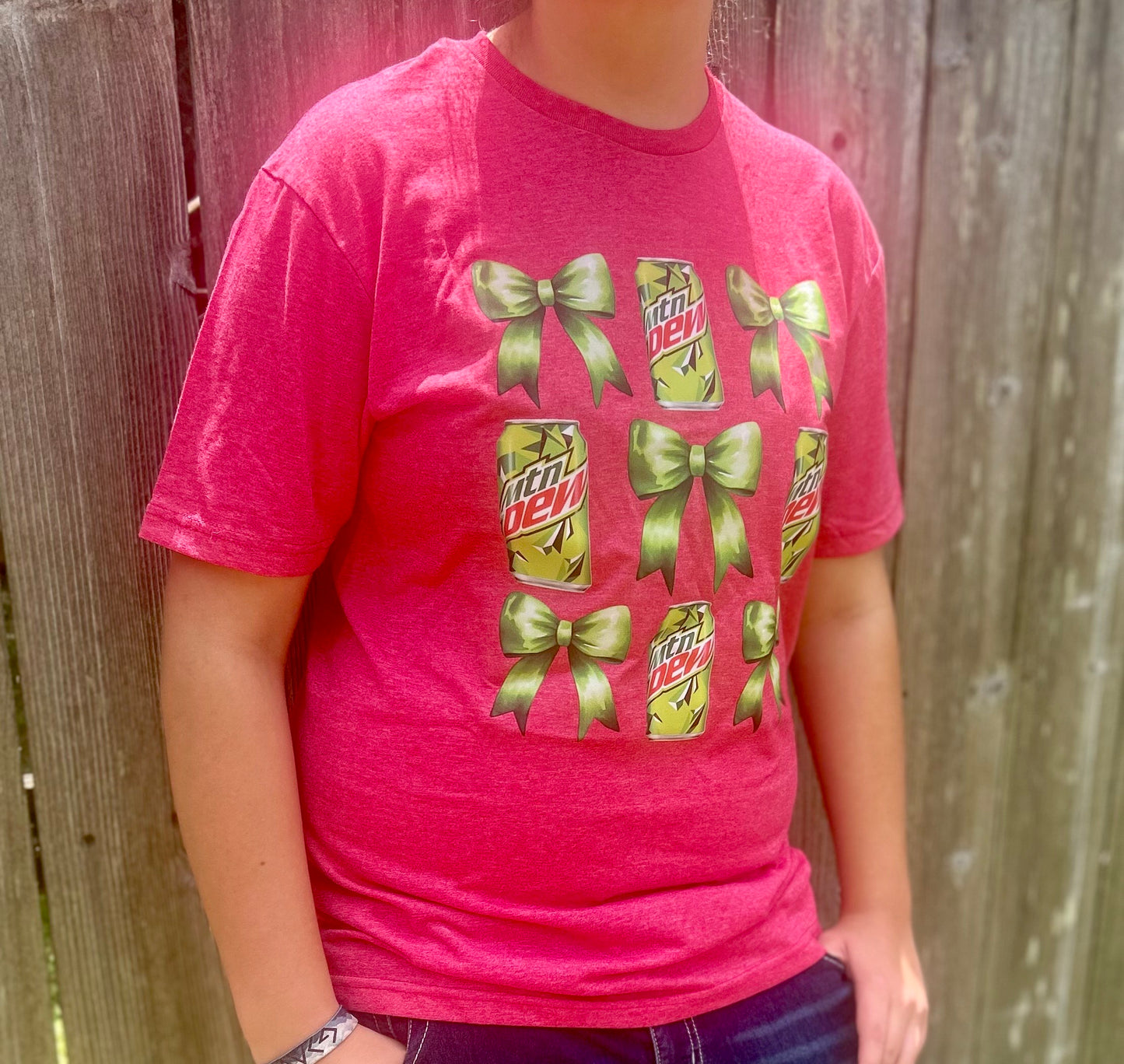 Get ready to "Dew" it all in style with our playful Bow & MTN Dew Tee!
