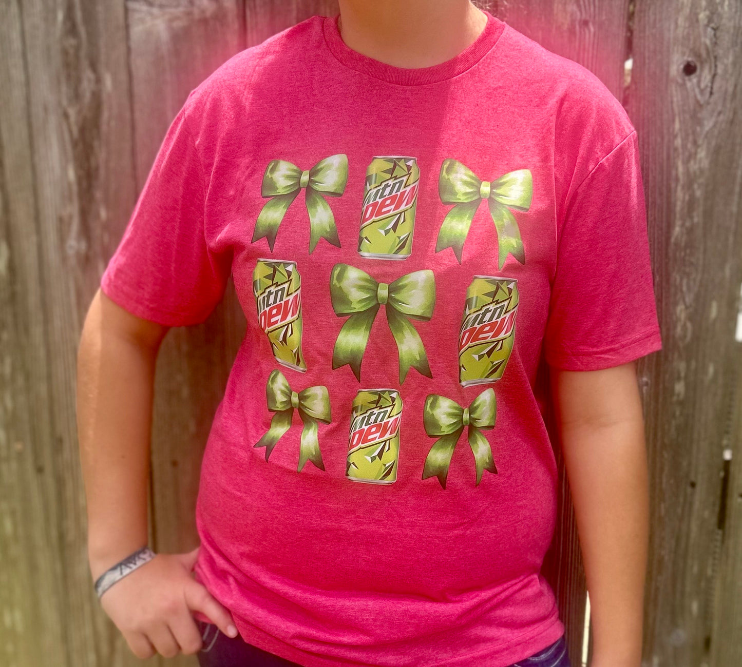 Get ready to "Dew" it all in style with our playful Bow & MTN Dew Tee!