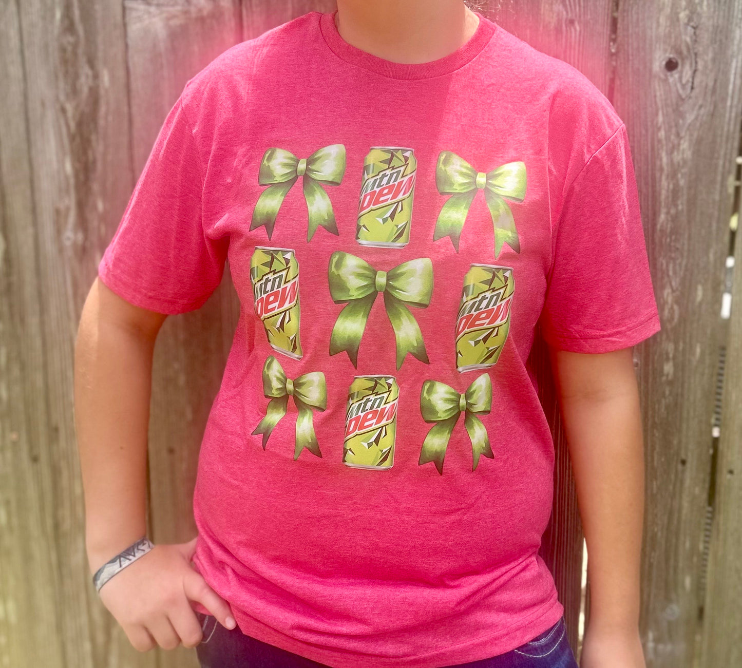 Get ready to "Dew" it all in style with our playful Bow & MTN Dew Tee!