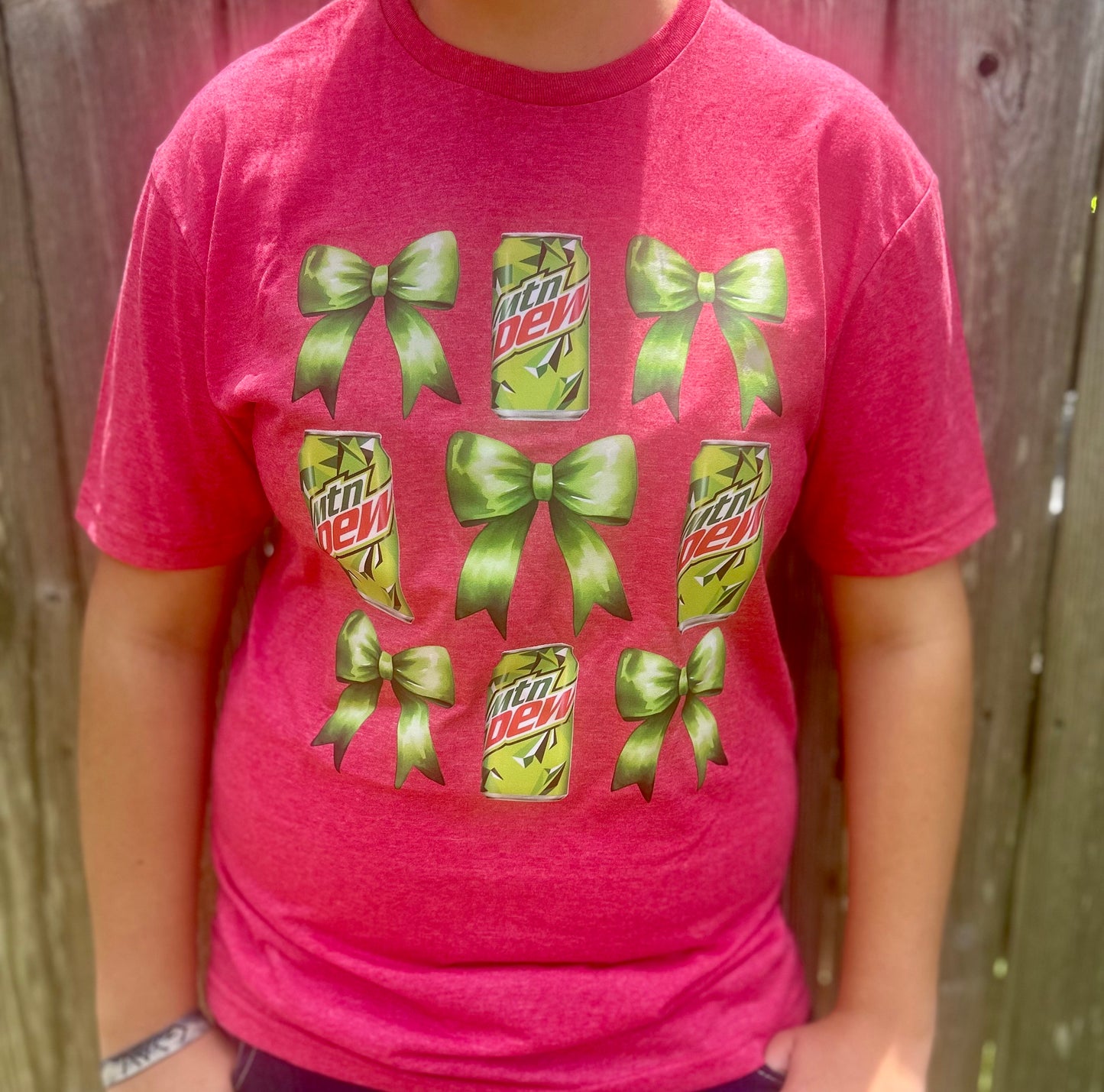 Get ready to "Dew" it all in style with our playful Bow & MTN Dew Tee!
